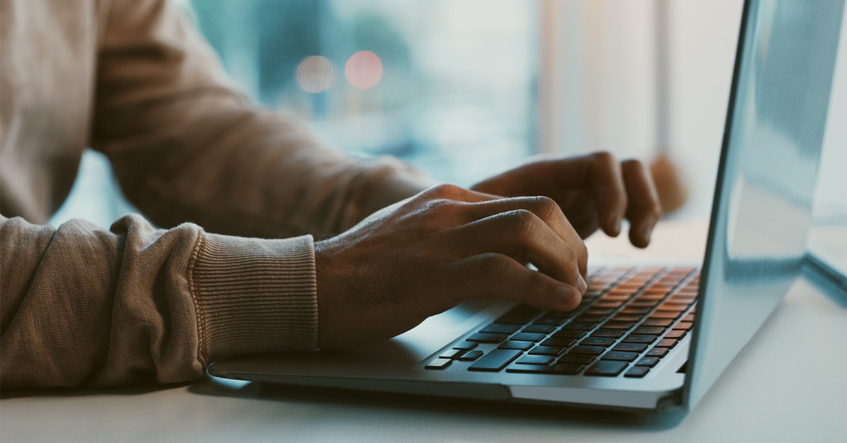 a person using a laptop computer